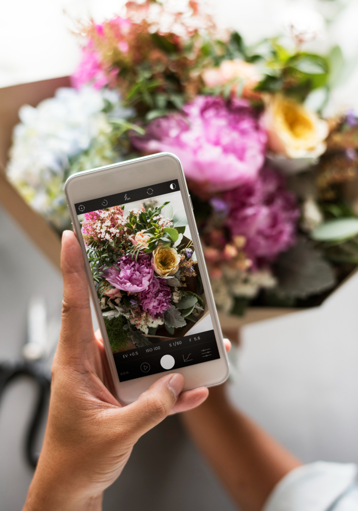 taking pictures of flowers for socialmedia