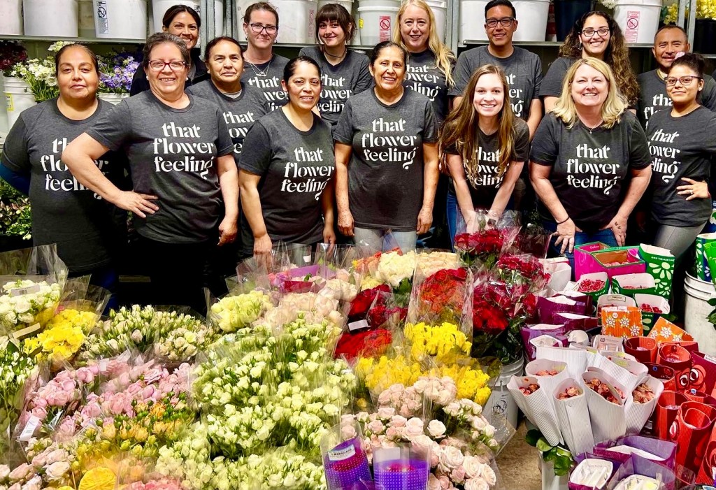 group wearing flower feeling shirts