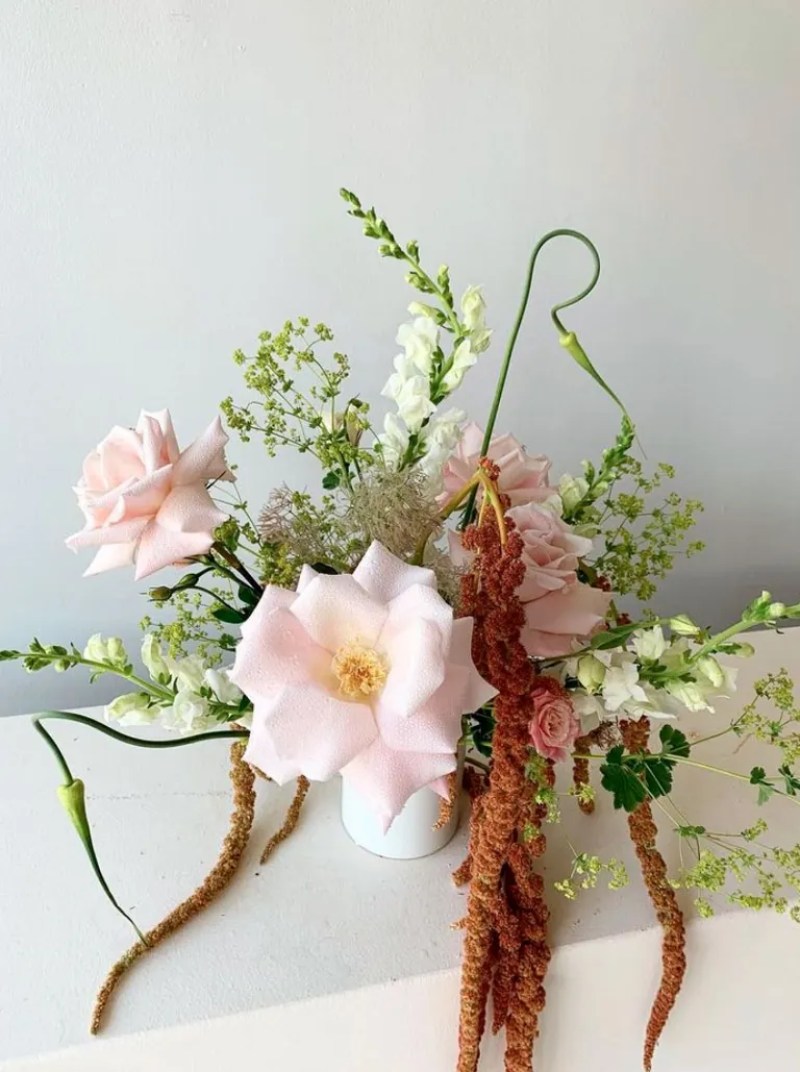 Bouquet by Miami florist Calma featuring big light pink flowers surrounding by smaller pink and white flowers Bouquet by Miami florist Calma featuring big light pink flowers surrounding by smaller pink and white flowers