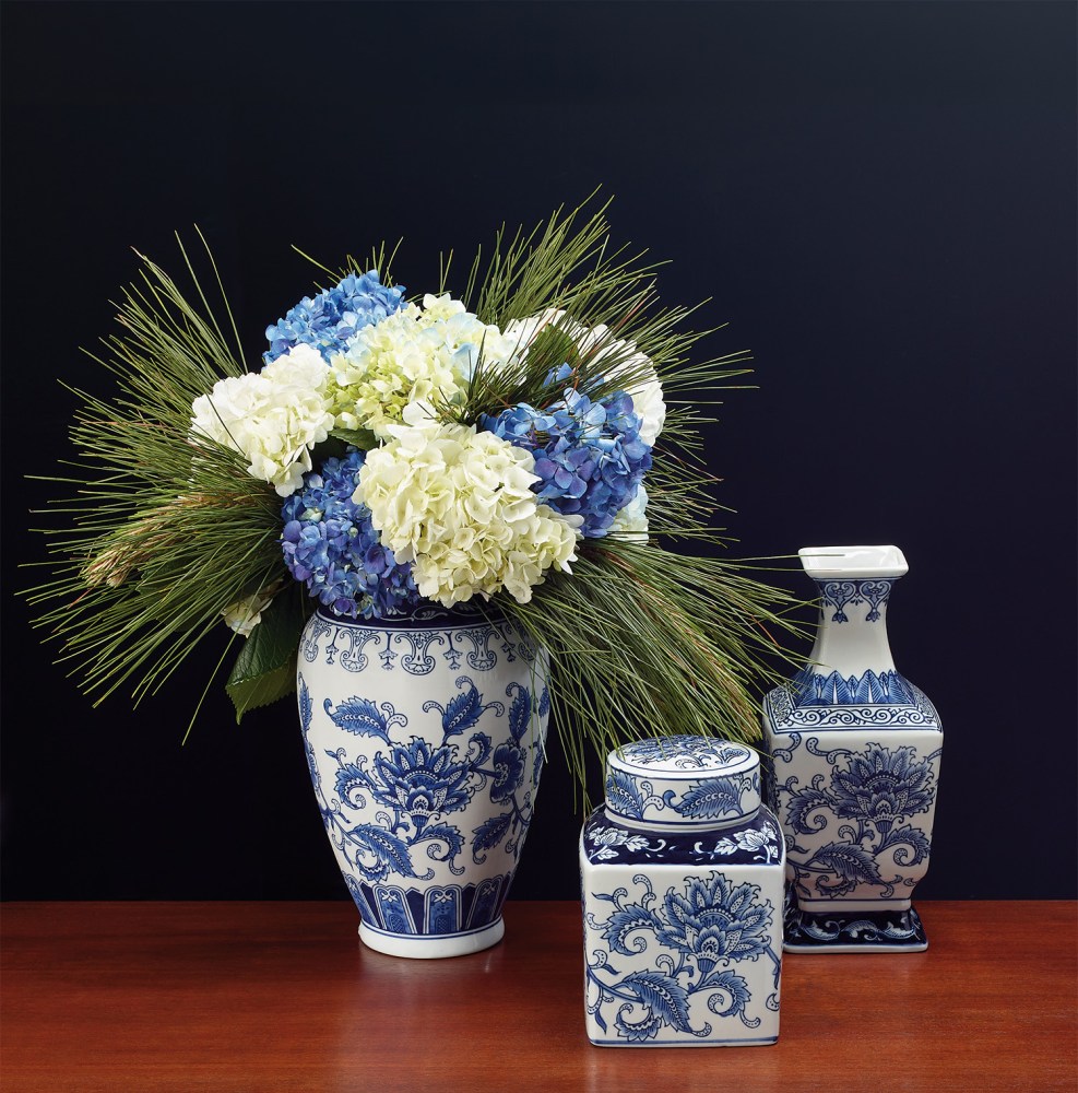 blue and white ceramice with winter flowers