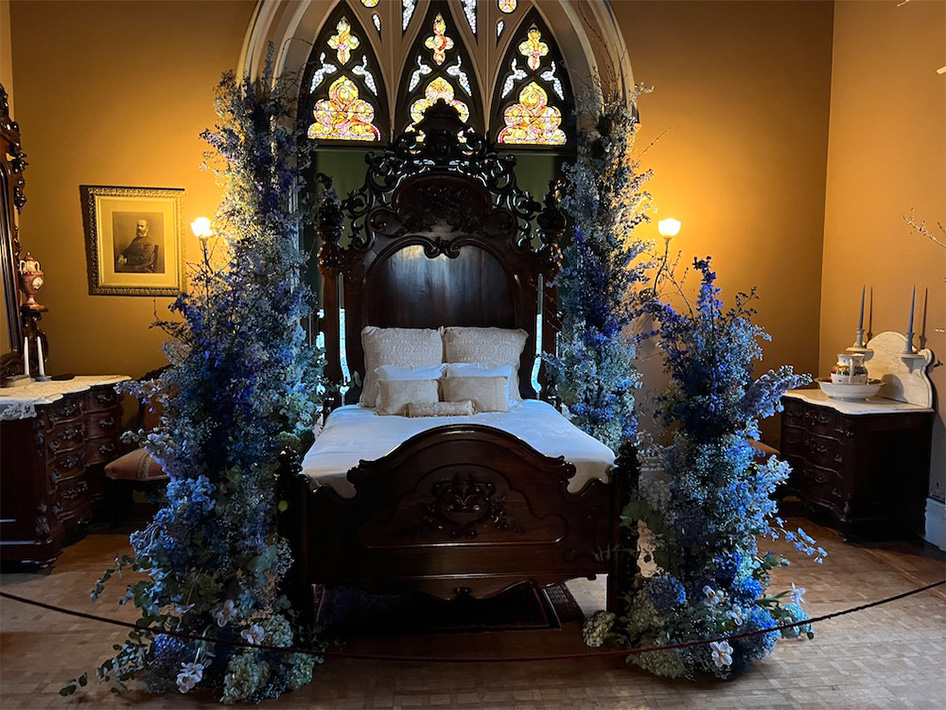 bed surrounded by flowers