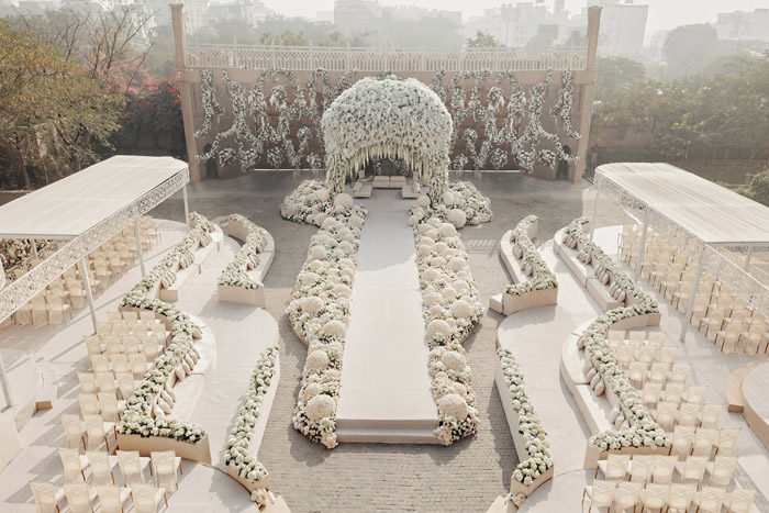 wedding ceremony with full flower decor in white