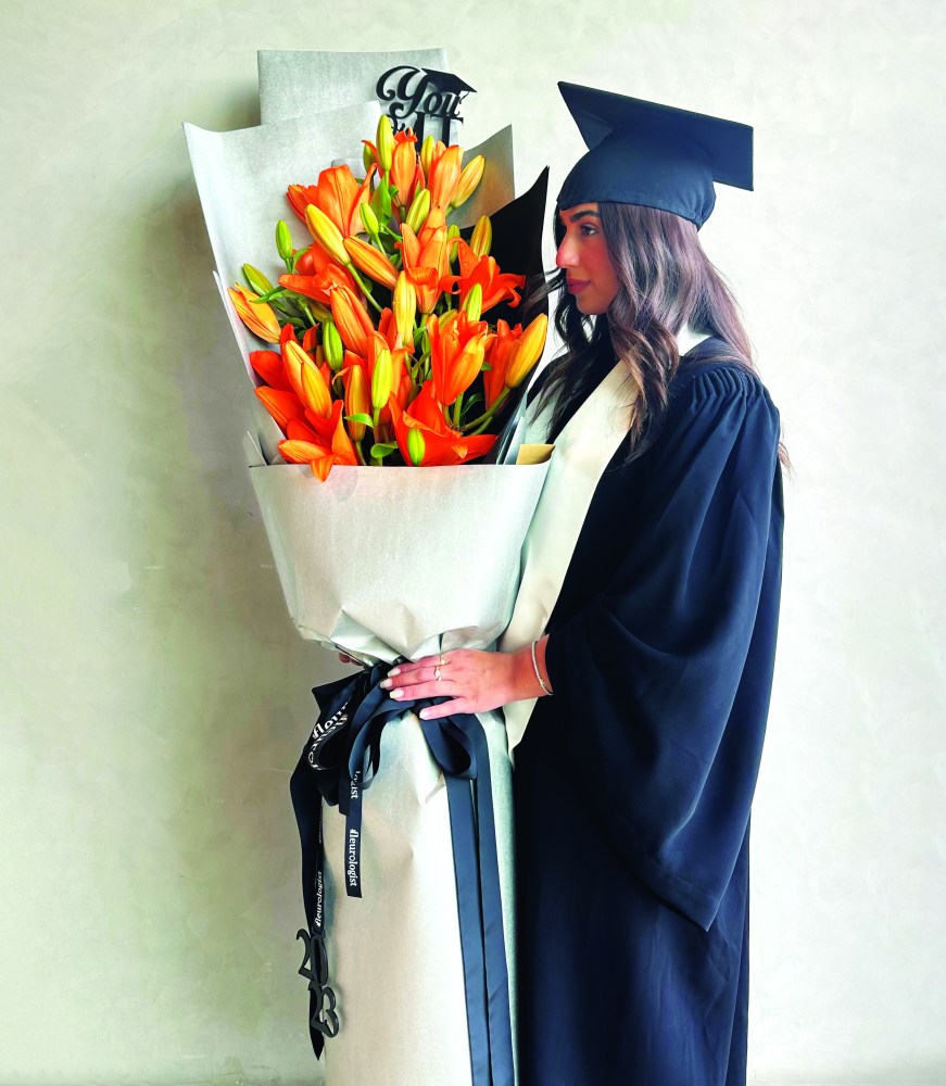 grad with big bouquet