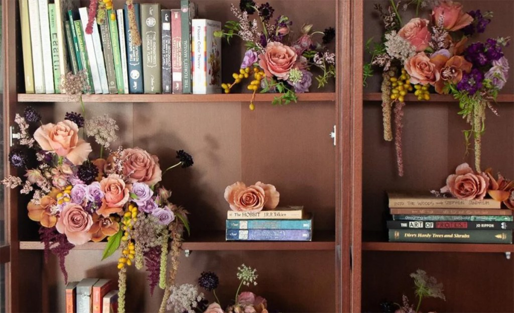 flora;l display on a bookcase