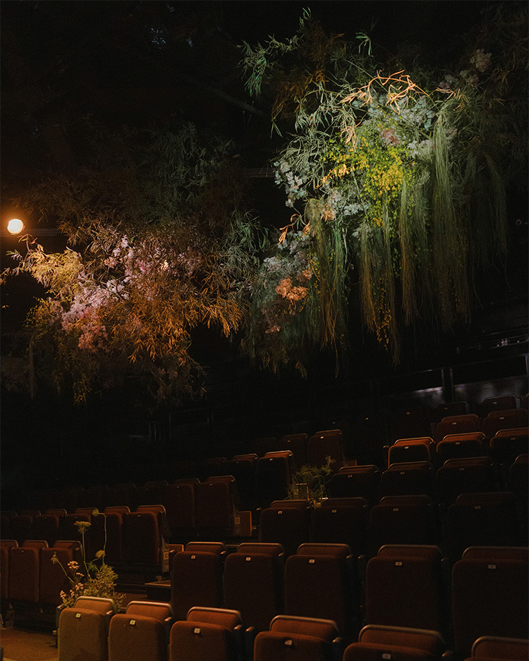 hanging flowers above audience